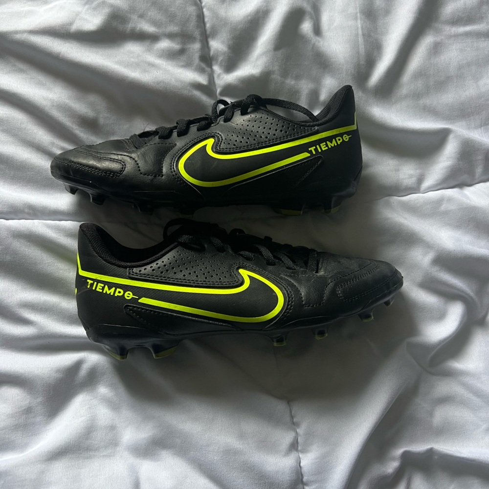 black and neon soccer cleats